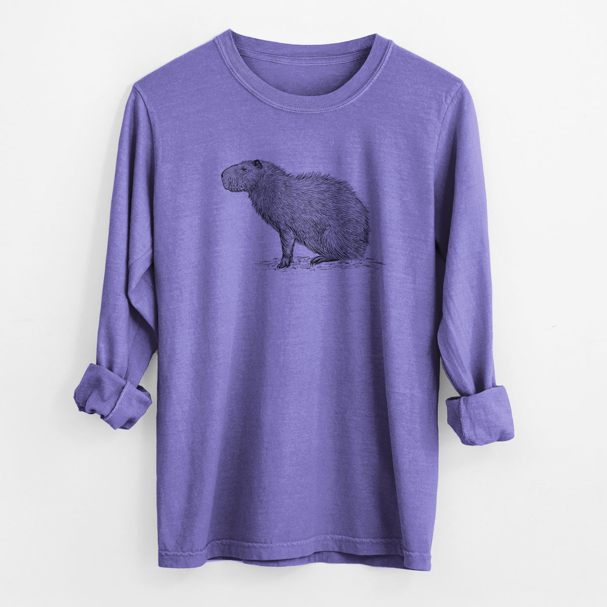 Violet purple Comfort Colors long sleeve shirt laid flat with the cuffs rolled, printed with a detailed black ink illustration of a capybara standing in profile.