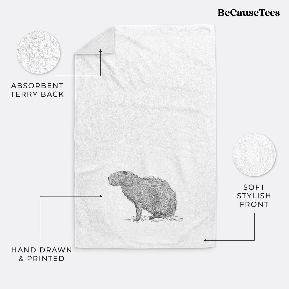 White hand towel printed with a detailed black ink illustration of a capybara standing in profile.