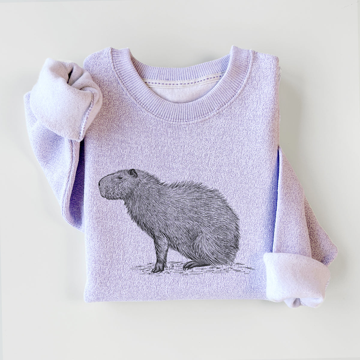 Ice purple knit sweatshirt printed with a detailed black ink illustration of a capybara standing in profile, styled flat.