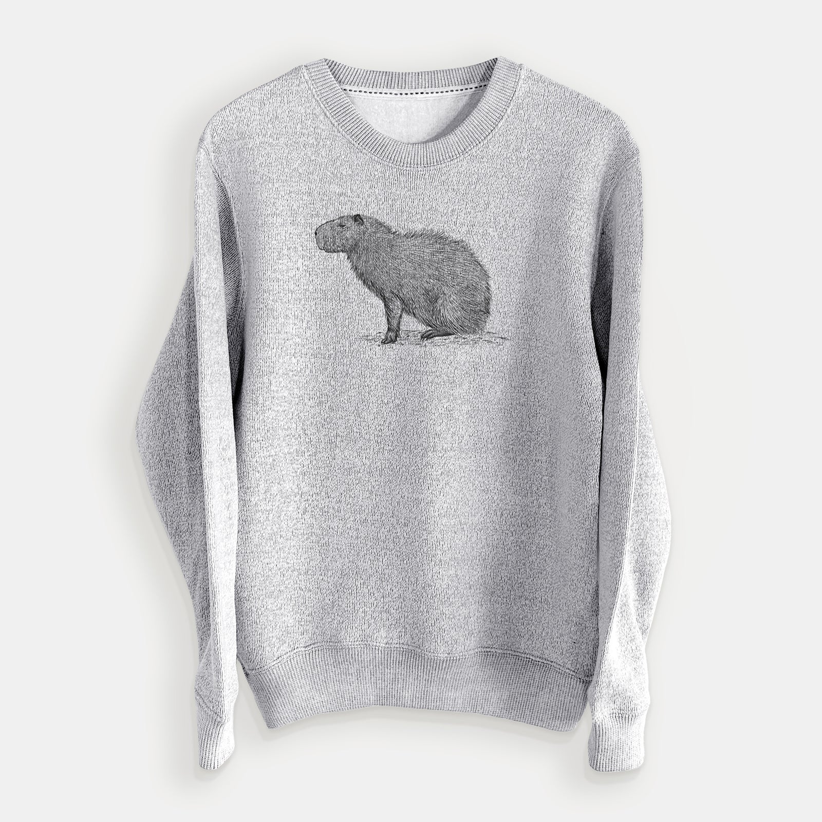 Salt and pepper knit sweatshirt laid flat, printed with a detailed black ink illustration of a capybara standing in profile.