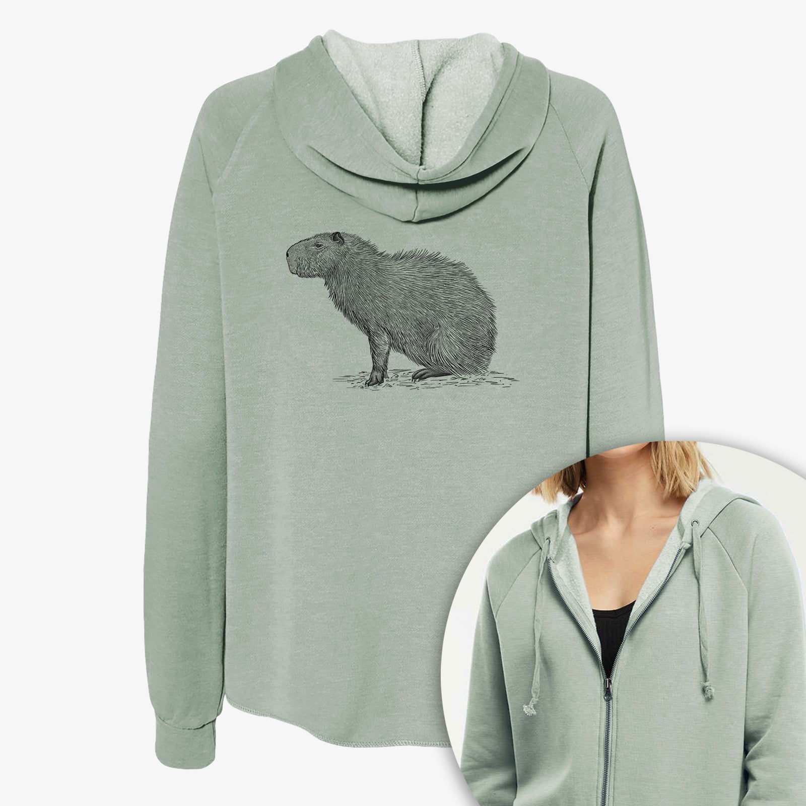 Women's Cali Wave zip-up sweatshirt printed with a detailed black ink illustration of a capybara standing in profile, with a close-up of the zipper.