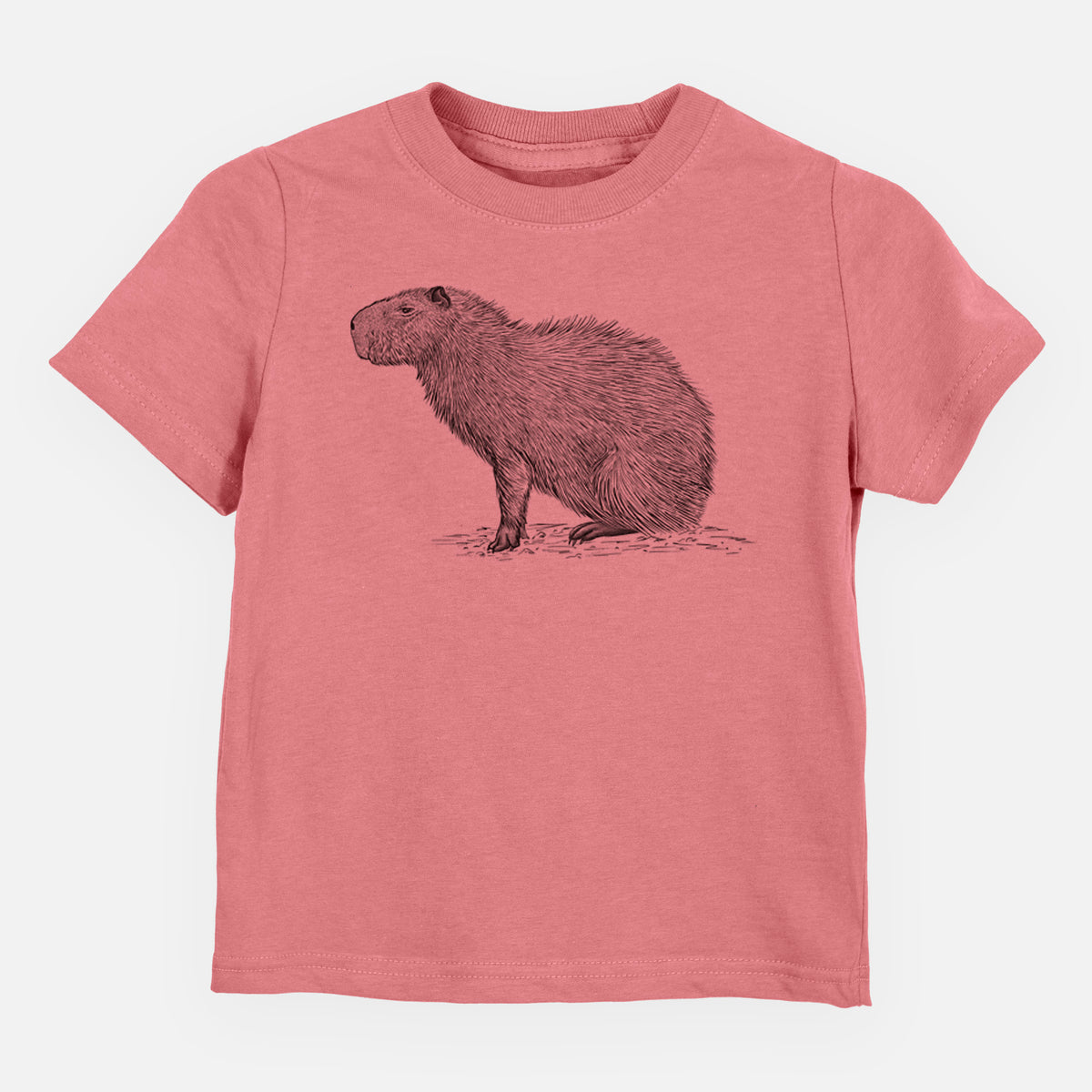 Mauve pink toddler t-shirt laid flat, printed with a detailed black ink illustration of a capybara standing in profile.