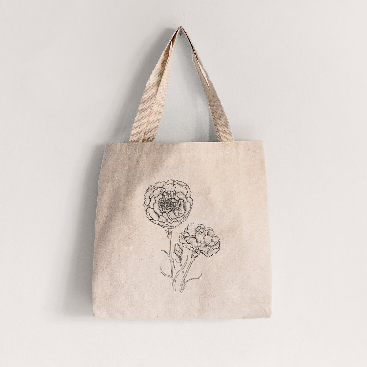 Natural canvas tote bag printed with a black ink line drawing of carnation flowers on stems.