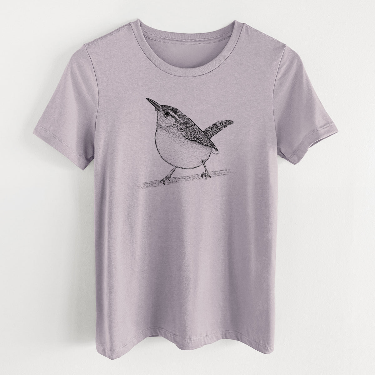 Light violet women's relaxed fit cotton t-shirt laid flat, printed with a detailed black ink sketch of a Carolina wren perched on a branch with its tail raised.
