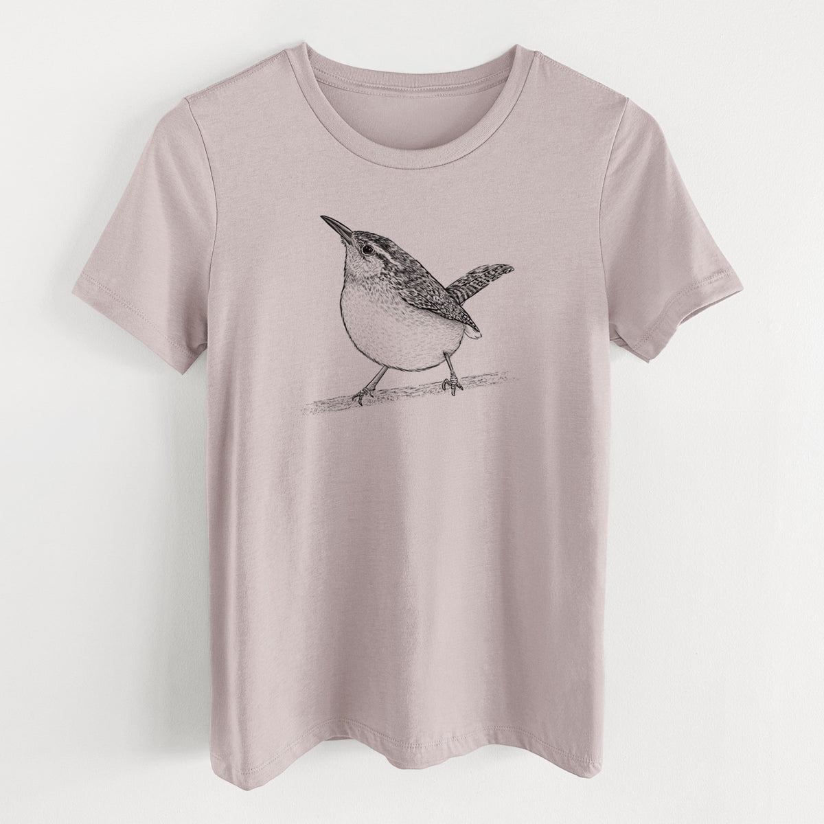 Pink gravel women's relaxed fit cotton t-shirt laid flat, printed with a detailed black ink sketch of a Carolina wren perched on a branch with its tail raised.