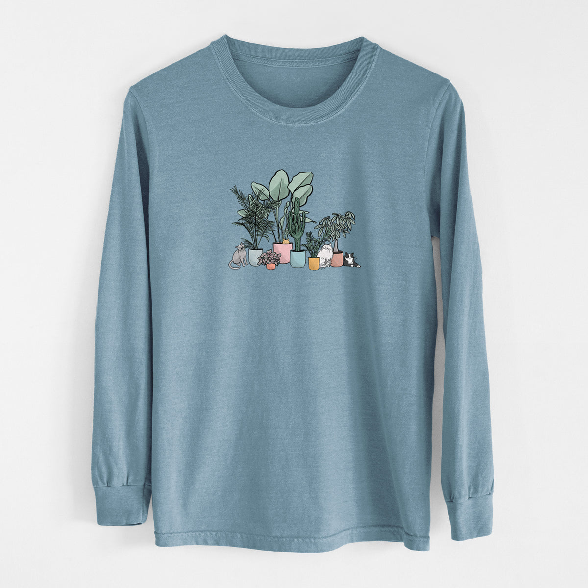 Steel blue Comfort Colors long sleeve shirt laid flat, printed with a full-color illustration of cats lounging among potted houseplants.