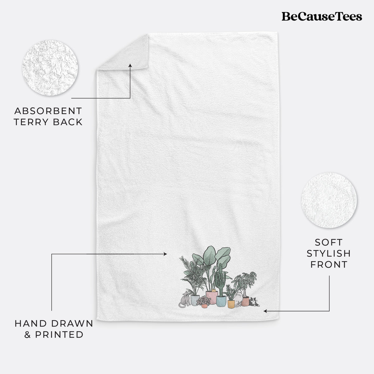 White hand towel printed with a full-color illustration of cats lounging among potted houseplants.
