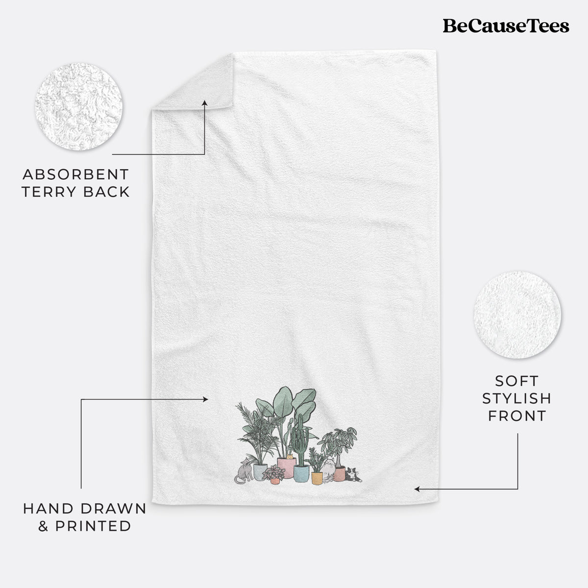 White hand towel printed with a full-color illustration of cats lounging among potted houseplants.
