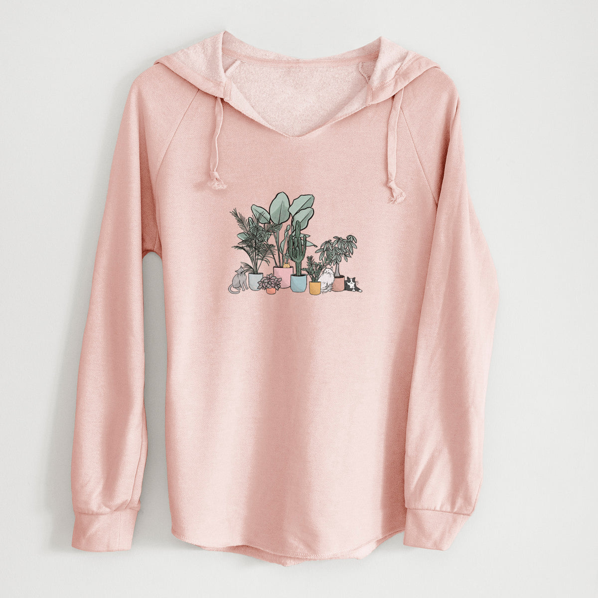 Blush pink women's Cali Wave hooded sweatshirt laid flat, printed with a full-color illustration of cats lounging among potted houseplants.