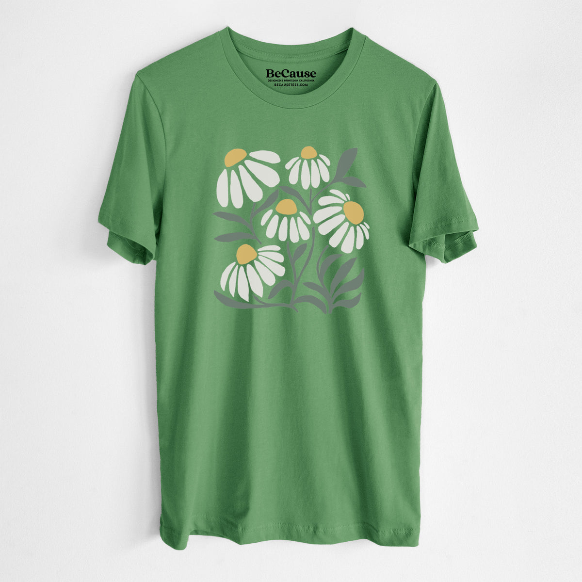 Leaf green lightweight cotton t-shirt laid flat, printed with a soft full-color illustration of white chamomile flowers and green leaves.