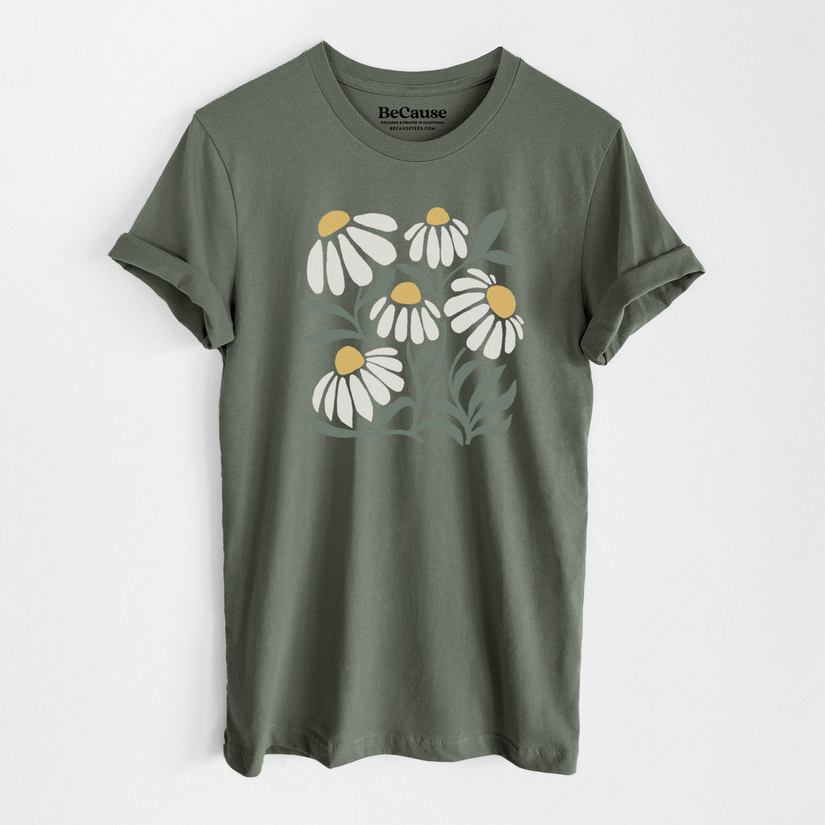 Military green lightweight cotton t-shirt laid flat, printed with a soft full-color illustration of white chamomile flowers and green leaves.
