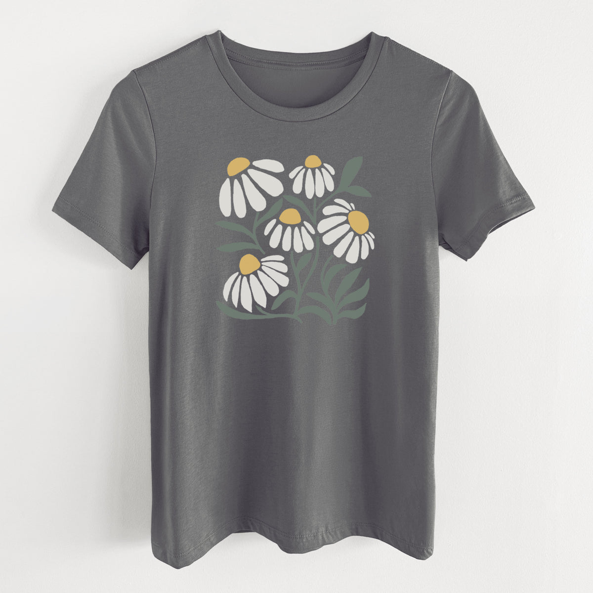 Asphalt women's relaxed fit cotton t-shirt laid flat, printed with a soft full-color illustration of white chamomile flowers and green leaves.