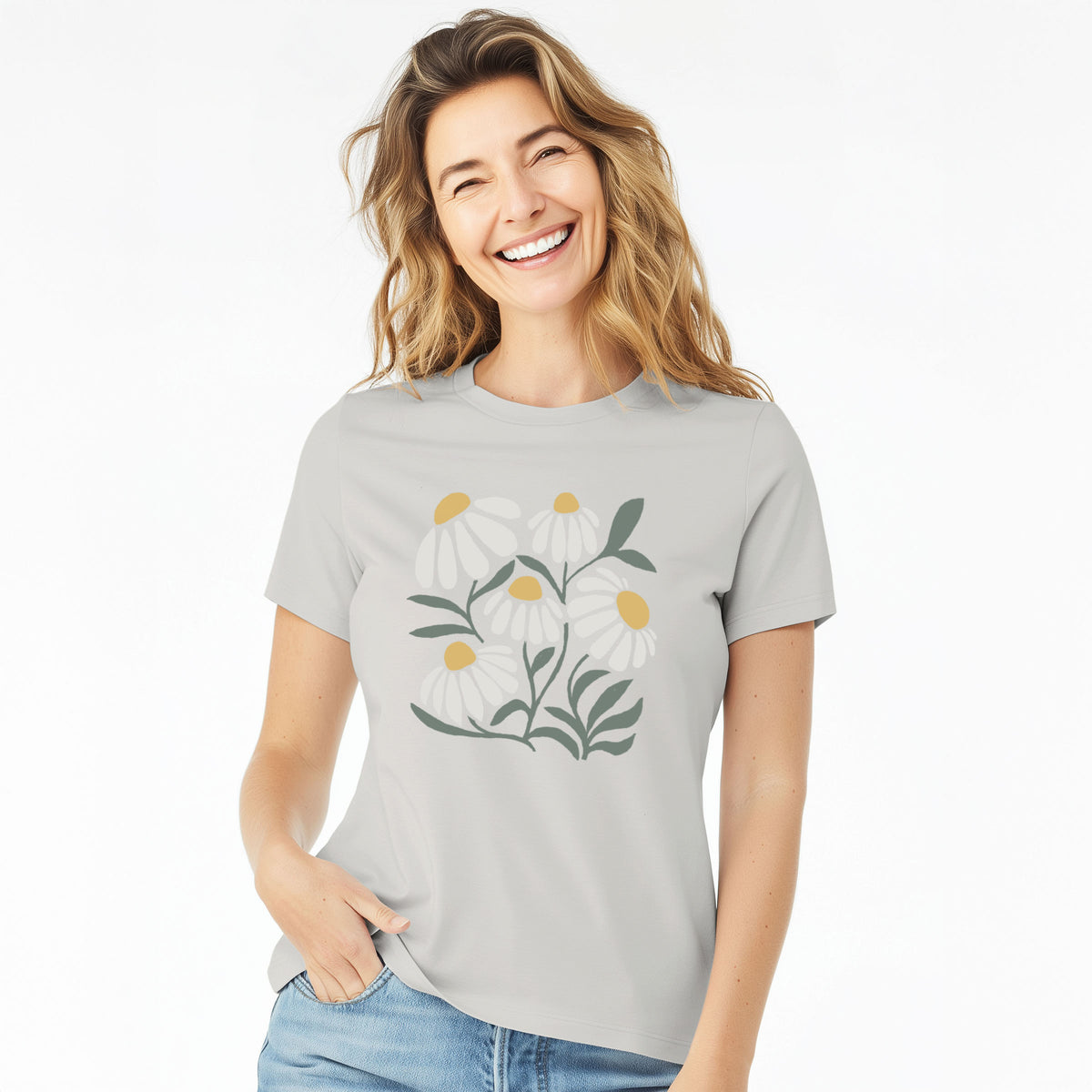 Woman wearing a lunar grey women's relaxed fit cotton t-shirt printed with a soft full-color illustration of white chamomile flowers and green leaves.