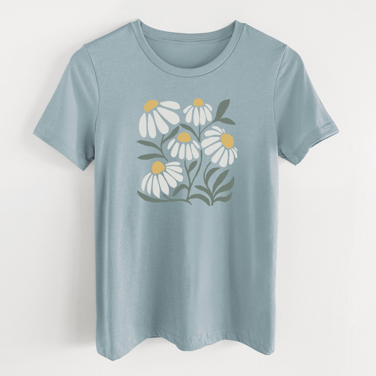 Vintage denim women's relaxed fit cotton t-shirt laid flat, printed with a soft full-color illustration of white chamomile flowers and green leaves.