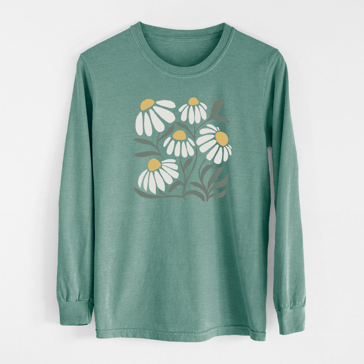 Pine green Comfort Colors long sleeve shirt laid flat, printed with a soft full-color illustration of white chamomile flowers and green leaves.