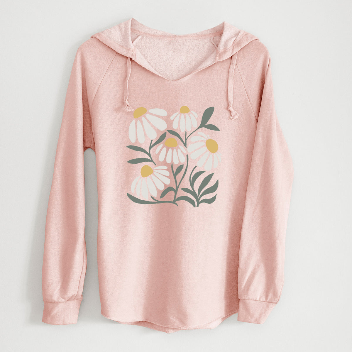 Blush pink women's Cali Wave hooded sweatshirt laid flat, printed with a soft full-color illustration of white chamomile flowers and green leaves.