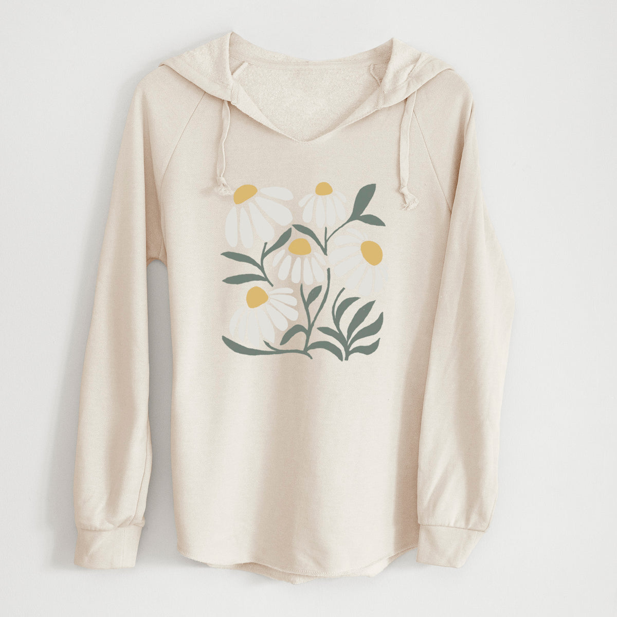 Bone cream women's Cali Wave hooded sweatshirt laid flat, printed with a soft full-color illustration of white chamomile flowers and green leaves.