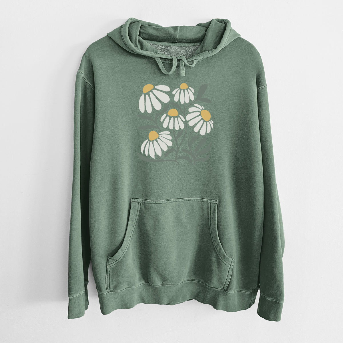 Alpine green pigment dyed hoodie laid flat, printed with a soft full-color illustration of white chamomile flowers and green leaves.