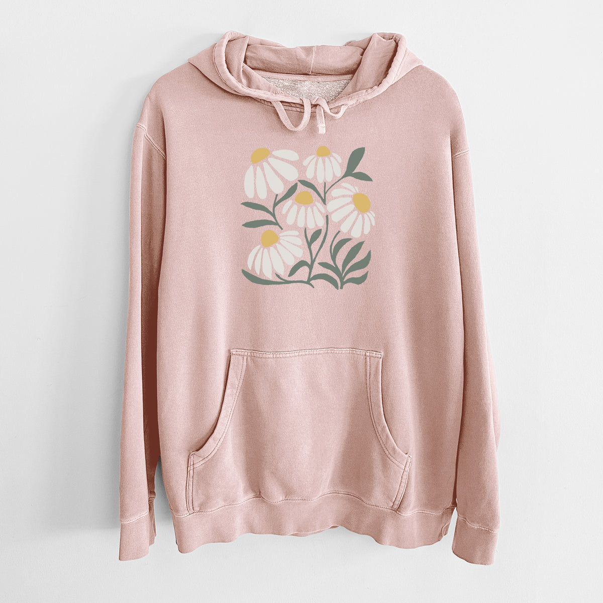 Dusty pink pigment dyed hoodie laid flat, printed with a soft full-color illustration of white chamomile flowers and green leaves.