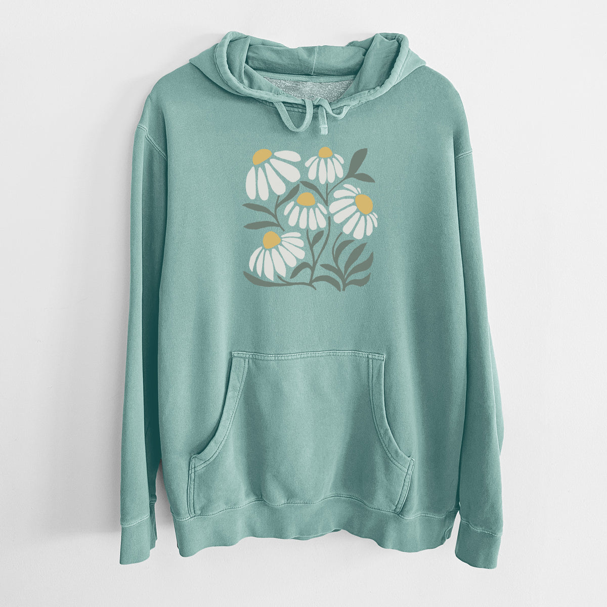 Mint green pigment dyed hoodie laid flat, printed with a soft full-color illustration of white chamomile flowers and green leaves.