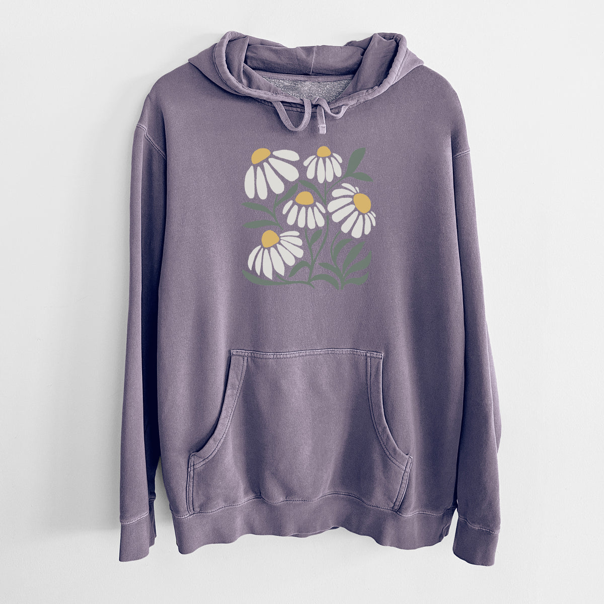 Plum purple pigment dyed hoodie laid flat, printed with a soft full-color illustration of white chamomile flowers and green leaves.