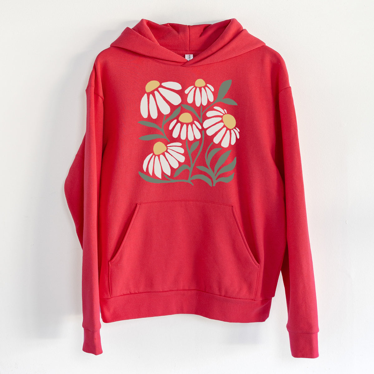 Chamomile Vibes - Statement Midweight Hoodie in Cherry Red, hanging on a white wall, with a front kangaroo pocket and no drawcords.