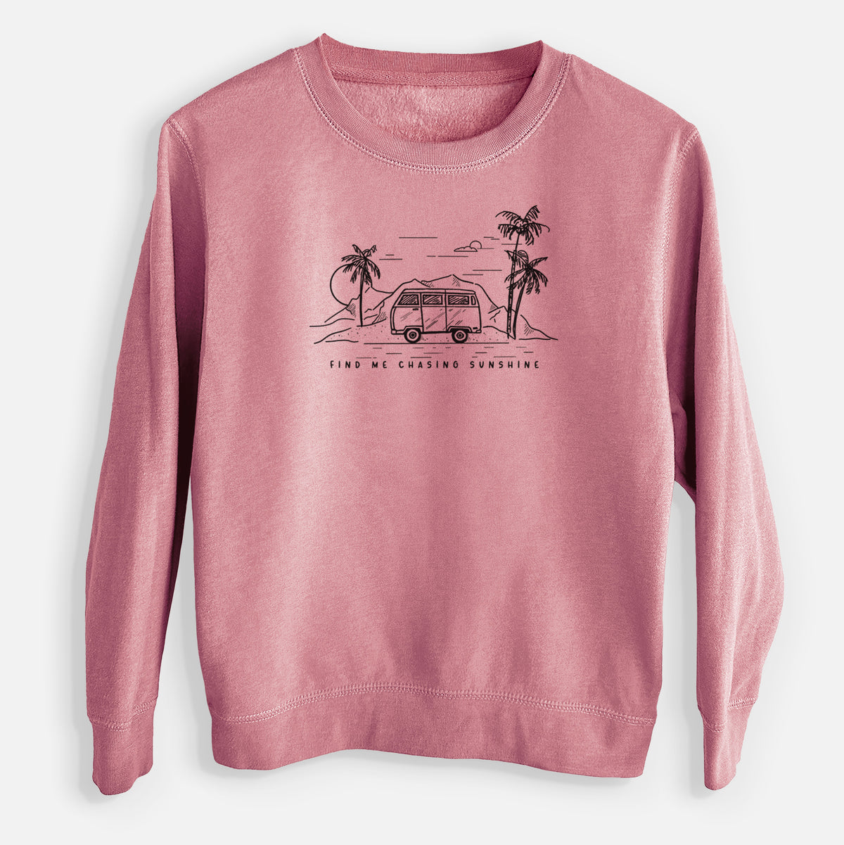 Mauve pink youth crewneck sweatshirt laid flat, printed with a black ink illustration of a camper van under palm trees and the sun, with the words Find Me Chasing Sunshine.