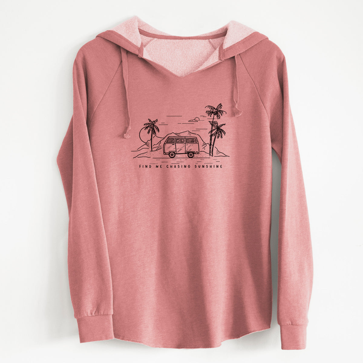 Dusty rose women's Cali Wave hooded sweatshirt laid flat, printed with a black ink illustration of a camper van under palm trees and the sun, with the words Find Me Chasing Sunshine.