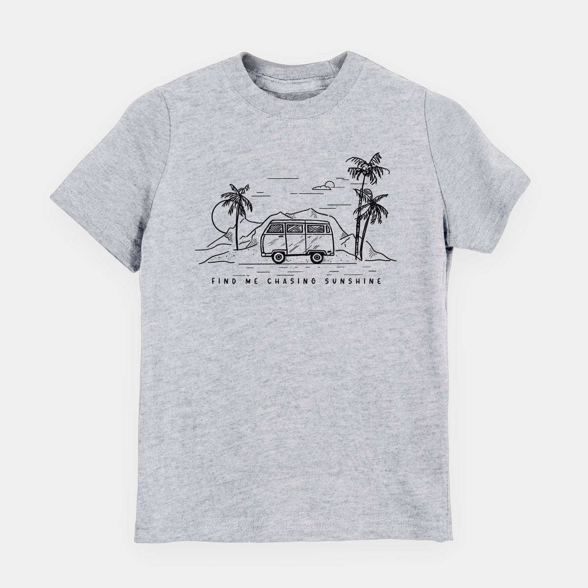 Heather grey youth t-shirt laid flat, printed with a black ink illustration of a camper van under palm trees and the sun, with the words Find Me Chasing Sunshine.