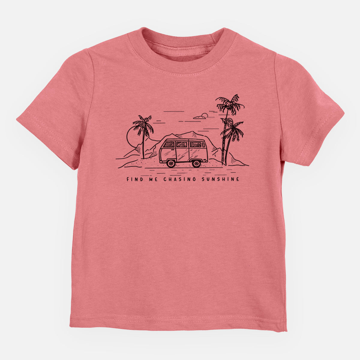 Mauve pink toddler t-shirt laid flat, printed with a black ink illustration of a camper van under palm trees and the sun, with the words Find Me Chasing Sunshine.