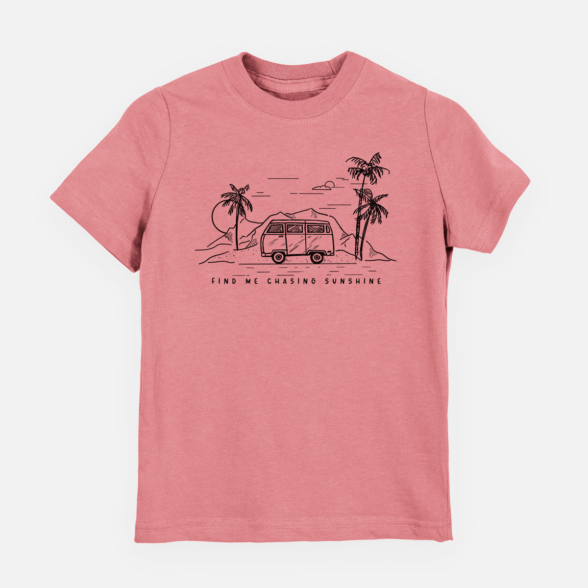 Mauve pink youth t-shirt laid flat, printed with a black ink illustration of a camper van under palm trees and the sun, with the words Find Me Chasing Sunshine.