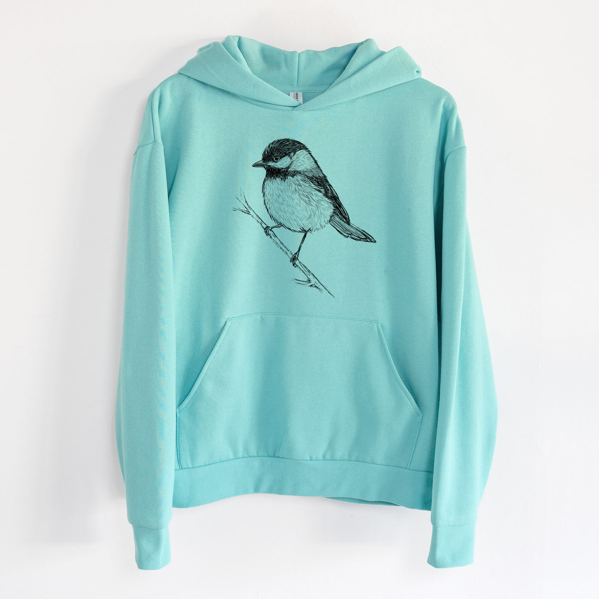 Black-capped Chickadee - Poecile atricapillus - Statement Midweight Hoodie in Seafoam, hanging on a white wall, with a front kangaroo pocket and no drawcords.