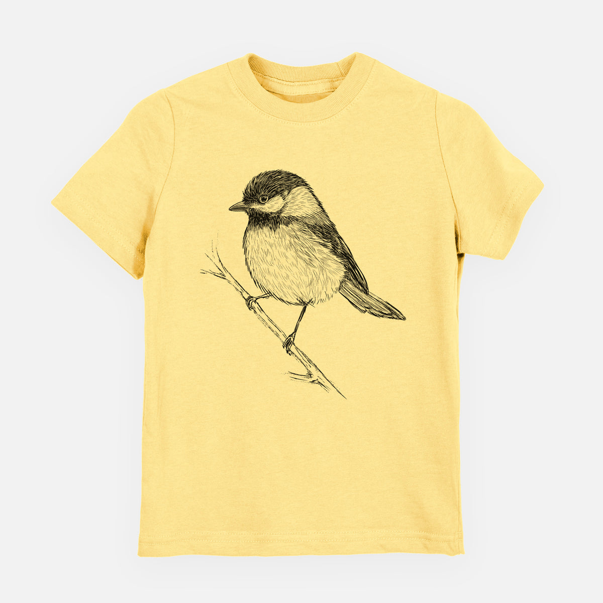 Butter yellow youth t-shirt laid flat, printed with a detailed black ink sketch of a black-capped chickadee perched on a branch.