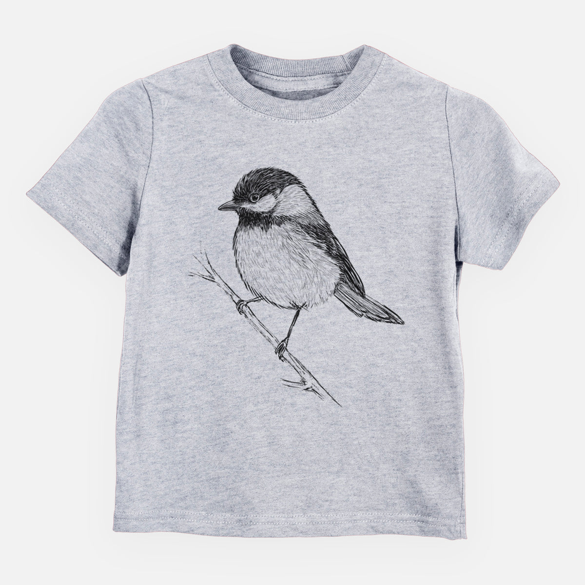 Heather grey toddler t-shirt laid flat, printed with a detailed black ink sketch of a black-capped chickadee perched on a branch.