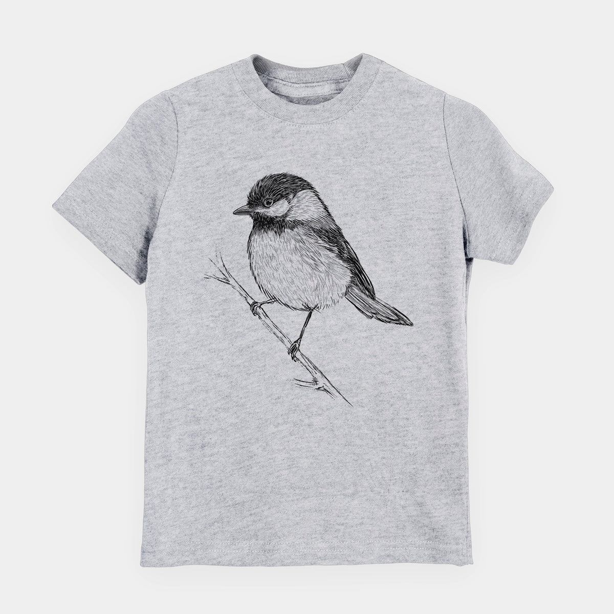 Heather grey youth t-shirt laid flat, printed with a detailed black ink sketch of a black-capped chickadee perched on a branch.