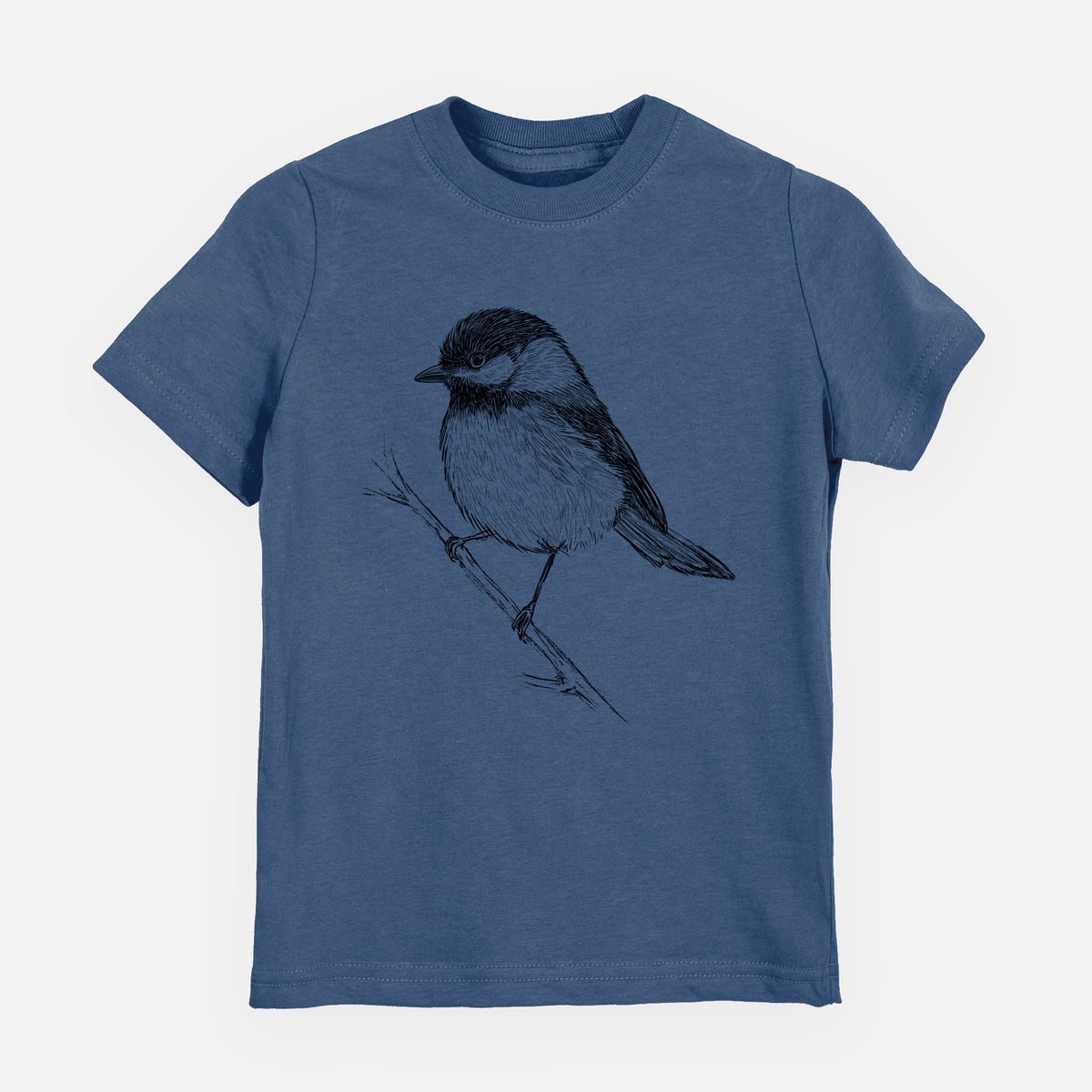 Indigo blue youth t-shirt laid flat, printed with a detailed black ink sketch of a black-capped chickadee perched on a branch.