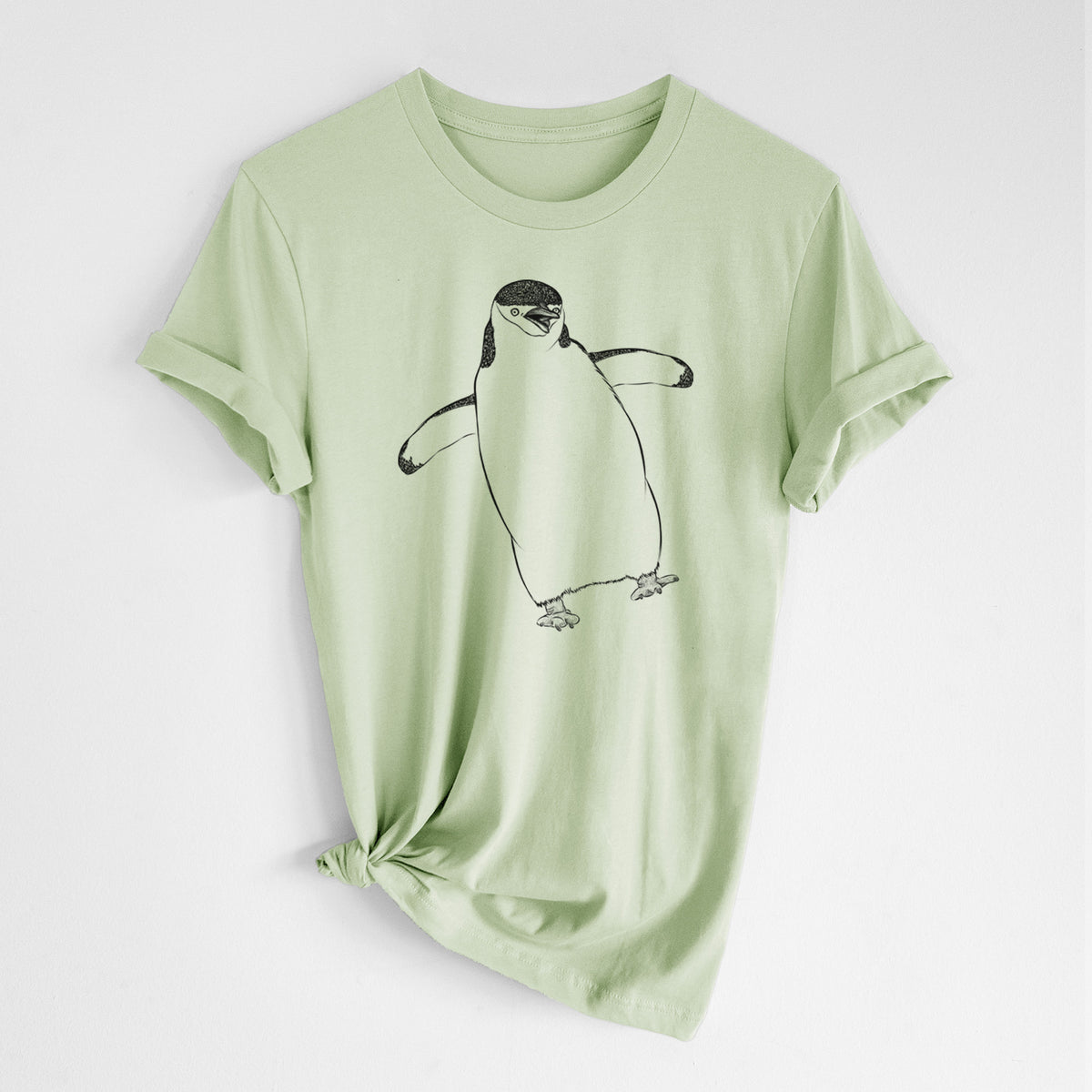Spring green lightweight cotton t-shirt laid flat with the sleeves rolled, printed with a black ink illustration of a chinstrap penguin standing with its flippers out.