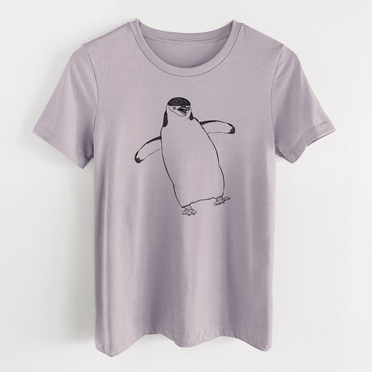 Light violet women's relaxed fit cotton t-shirt laid flat, printed with a black ink illustration of a chinstrap penguin standing with its flippers out.