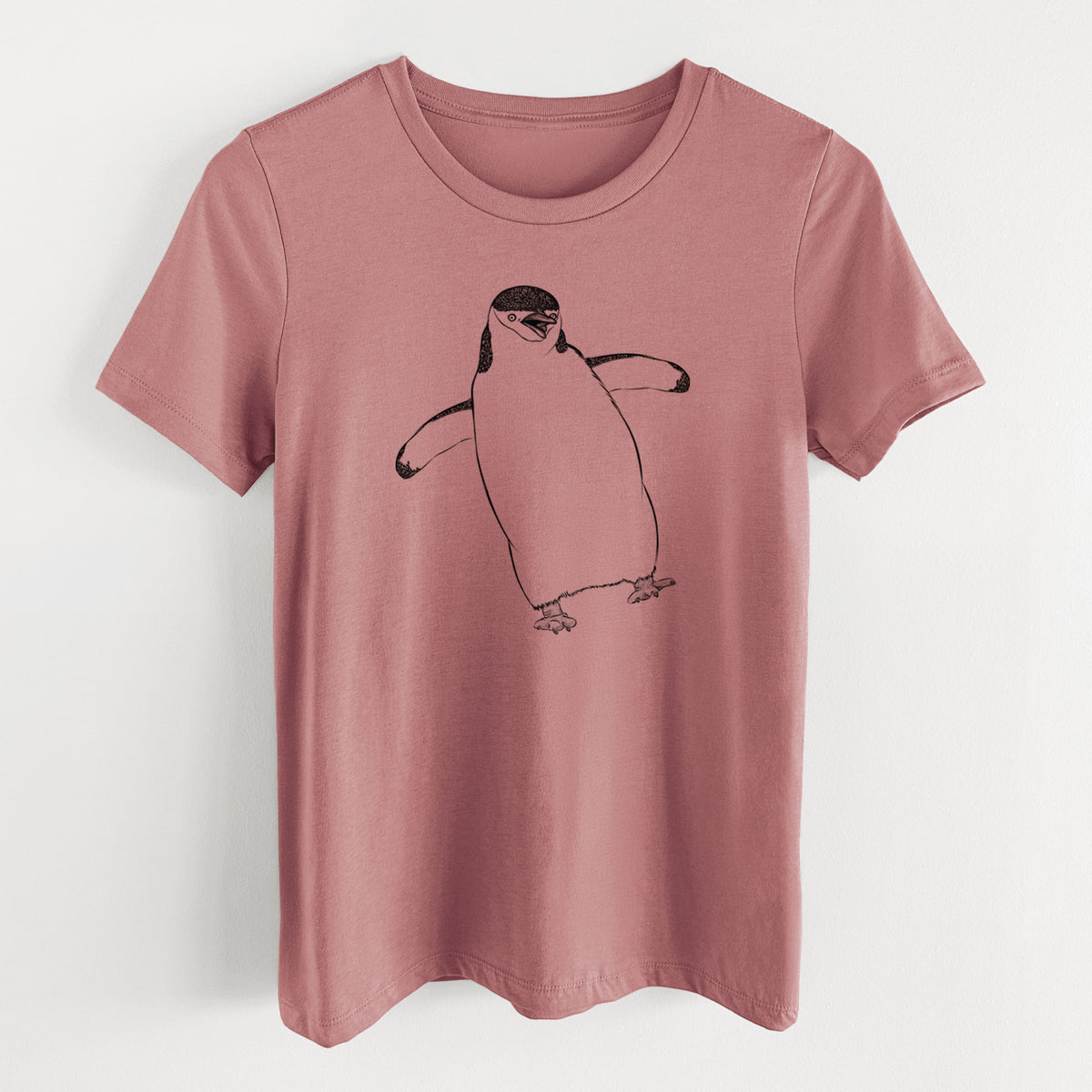 Mauve pink women's relaxed fit cotton t-shirt laid flat, printed with a black ink illustration of a chinstrap penguin standing with its flippers out.