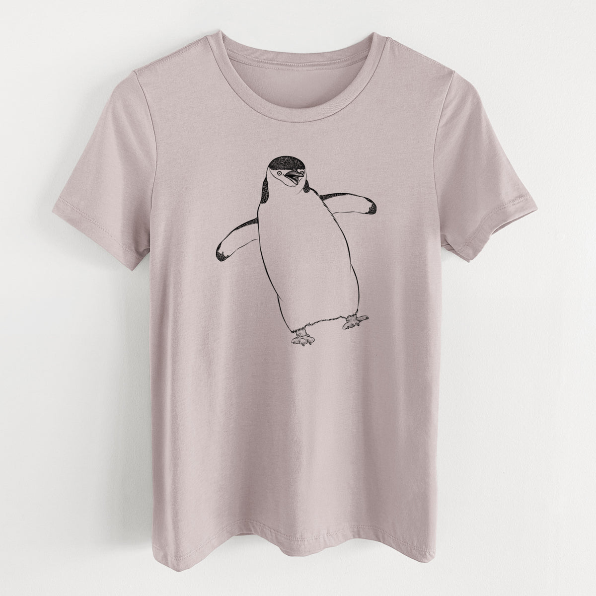 Pink gravel women's relaxed fit cotton t-shirt laid flat, printed with a black ink illustration of a chinstrap penguin standing with its flippers out.