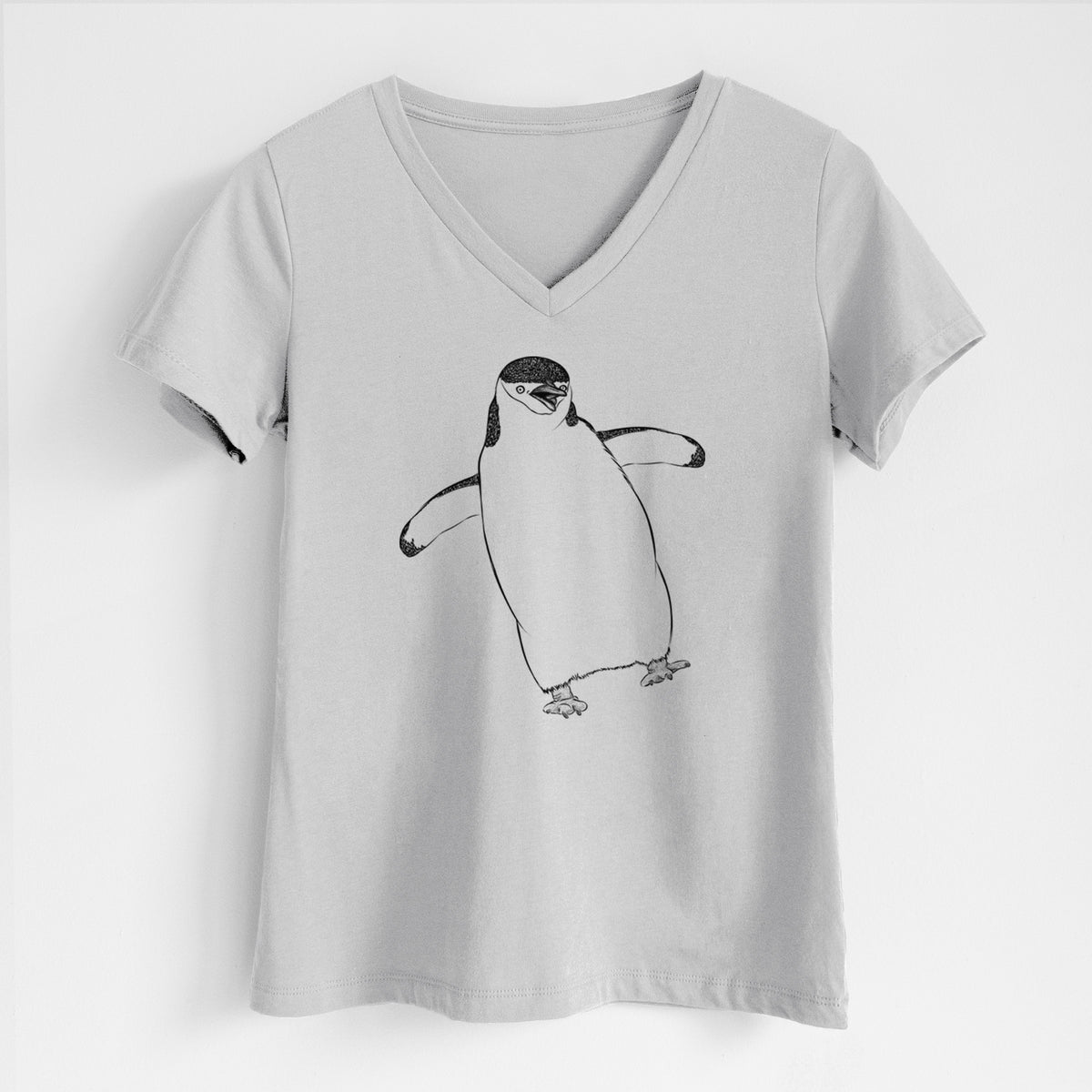 Lunar grey women's relaxed fit cotton V-neck t-shirt laid flat, printed with a black ink illustration of a chinstrap penguin standing with its flippers out.