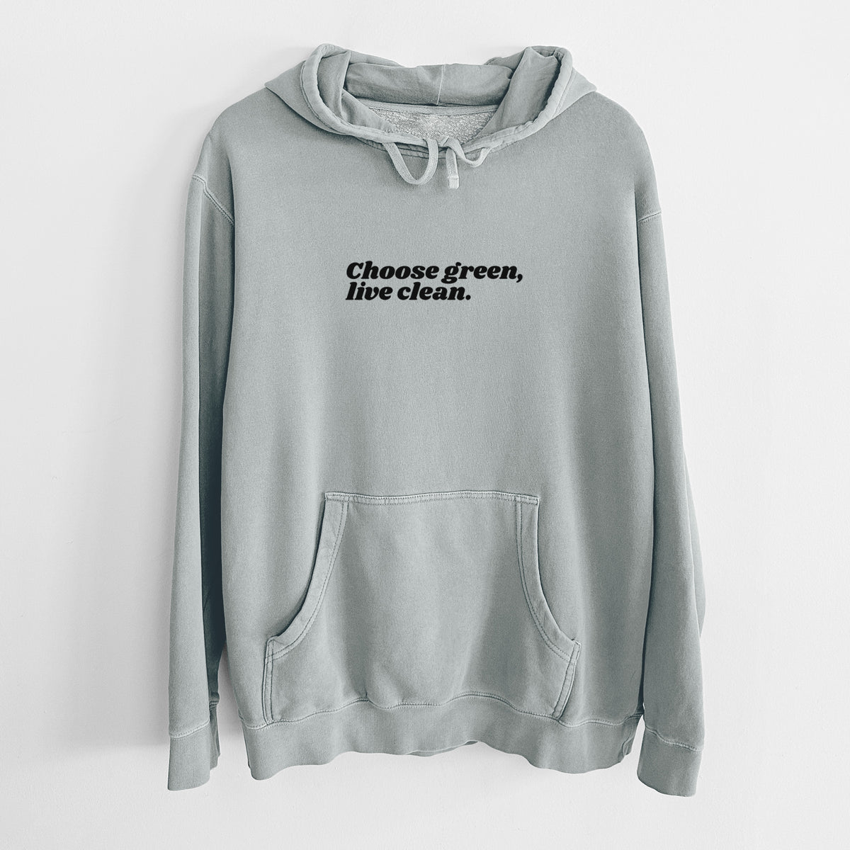 Sage green pigment dyed hoodie laid flat, printed with small black script words reading Choose Green, Live Clean on the upper chest.
