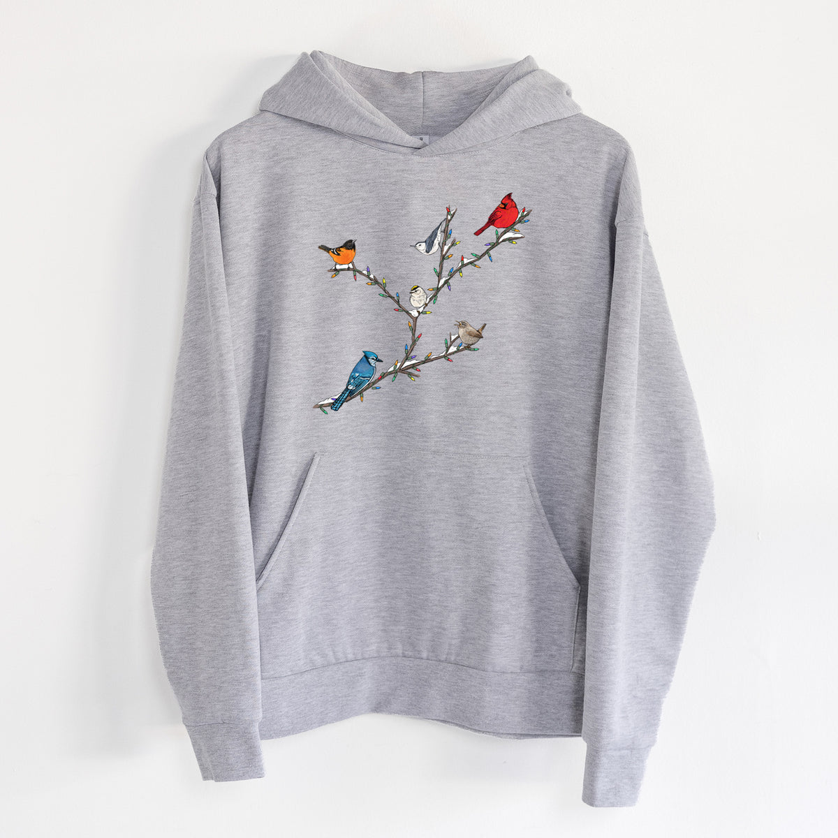 Christmas Backyard Birds - Statement Midweight Hoodie in Heather Grey, hanging on a white wall, with a front kangaroo pocket and no drawcords.