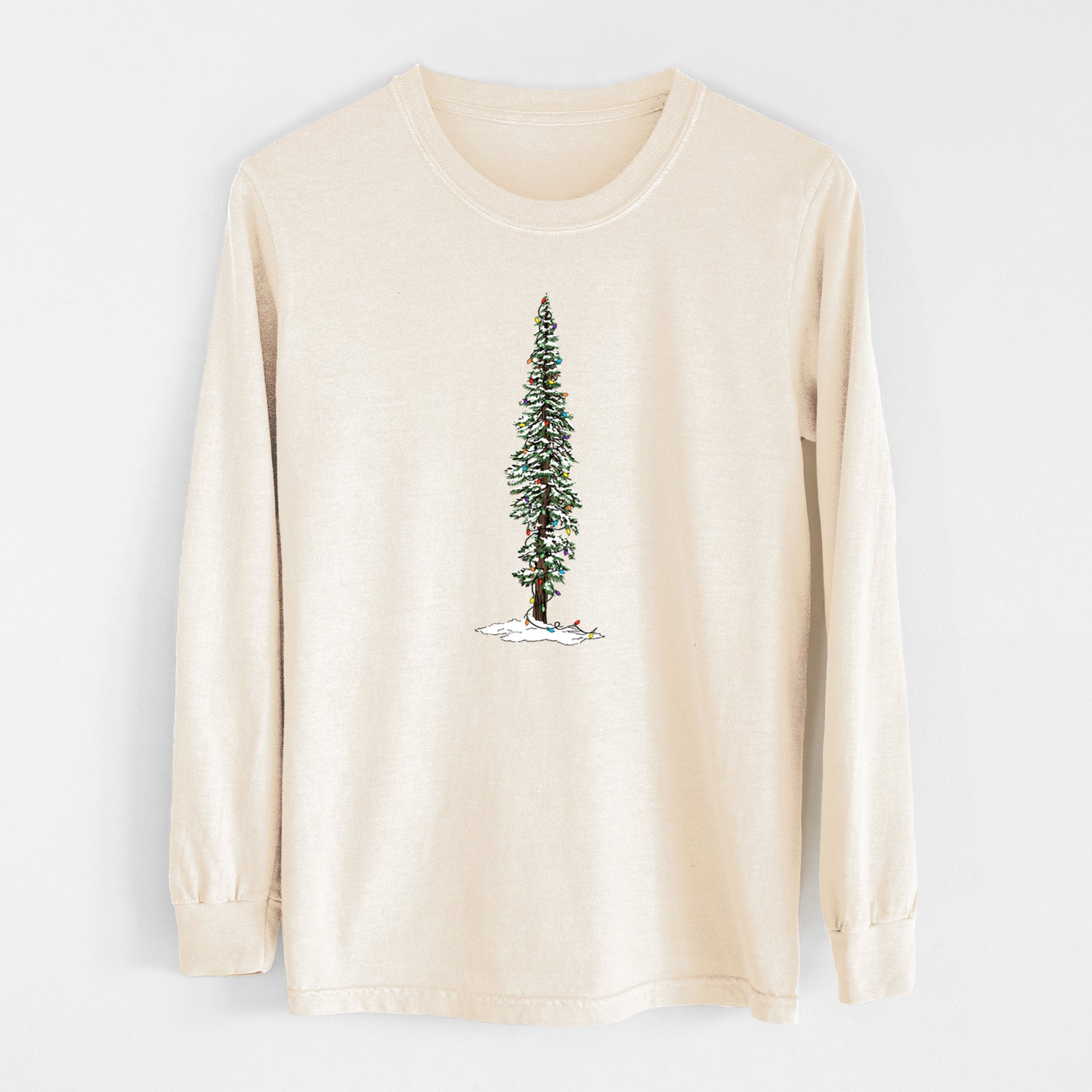 Ivory Comfort Colors long sleeve shirt laid flat, printed with a full-color illustration of a tall redwood tree dusted with snow and strung with holiday lights.