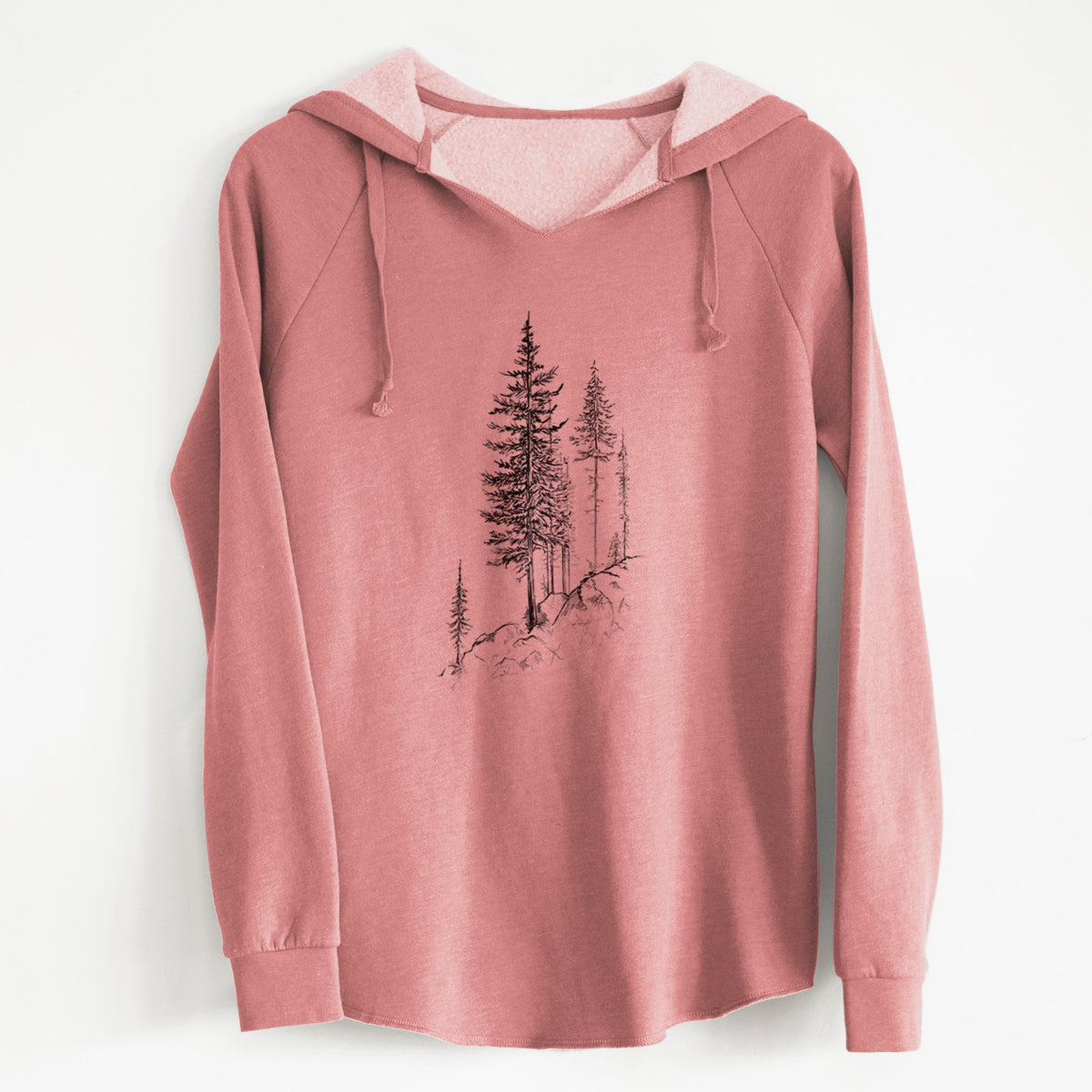 Dusty rose women's Cali Wave hooded sweatshirt laid flat, printed with a black ink illustration of tall pine trees growing from a rocky cliff.
