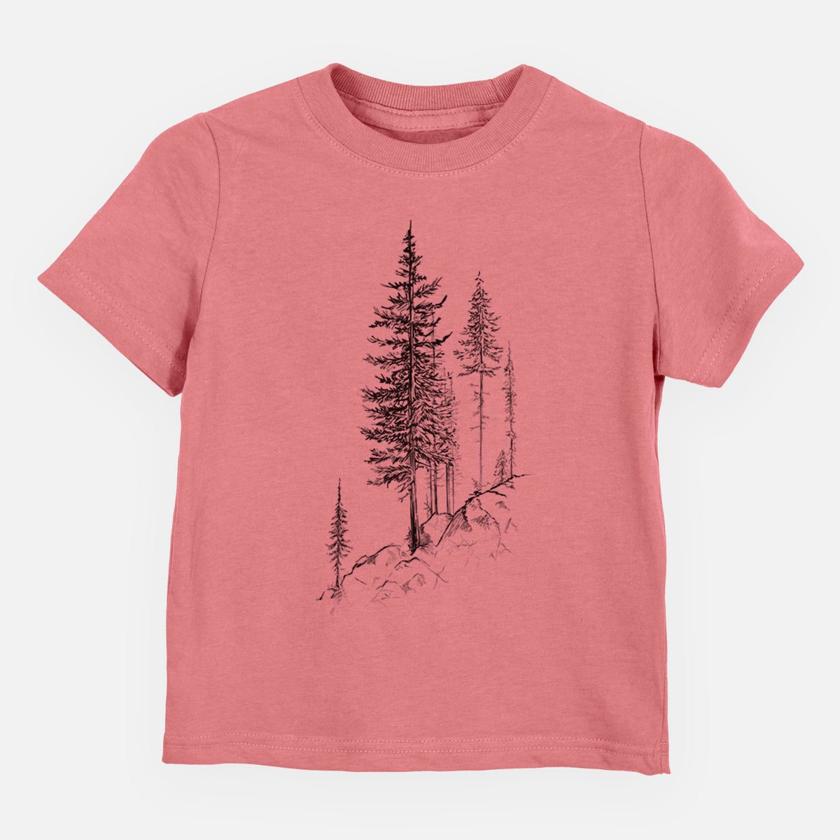 Mauve pink toddler t-shirt laid flat, printed with a black ink illustration of tall pine trees growing from a rocky cliff.