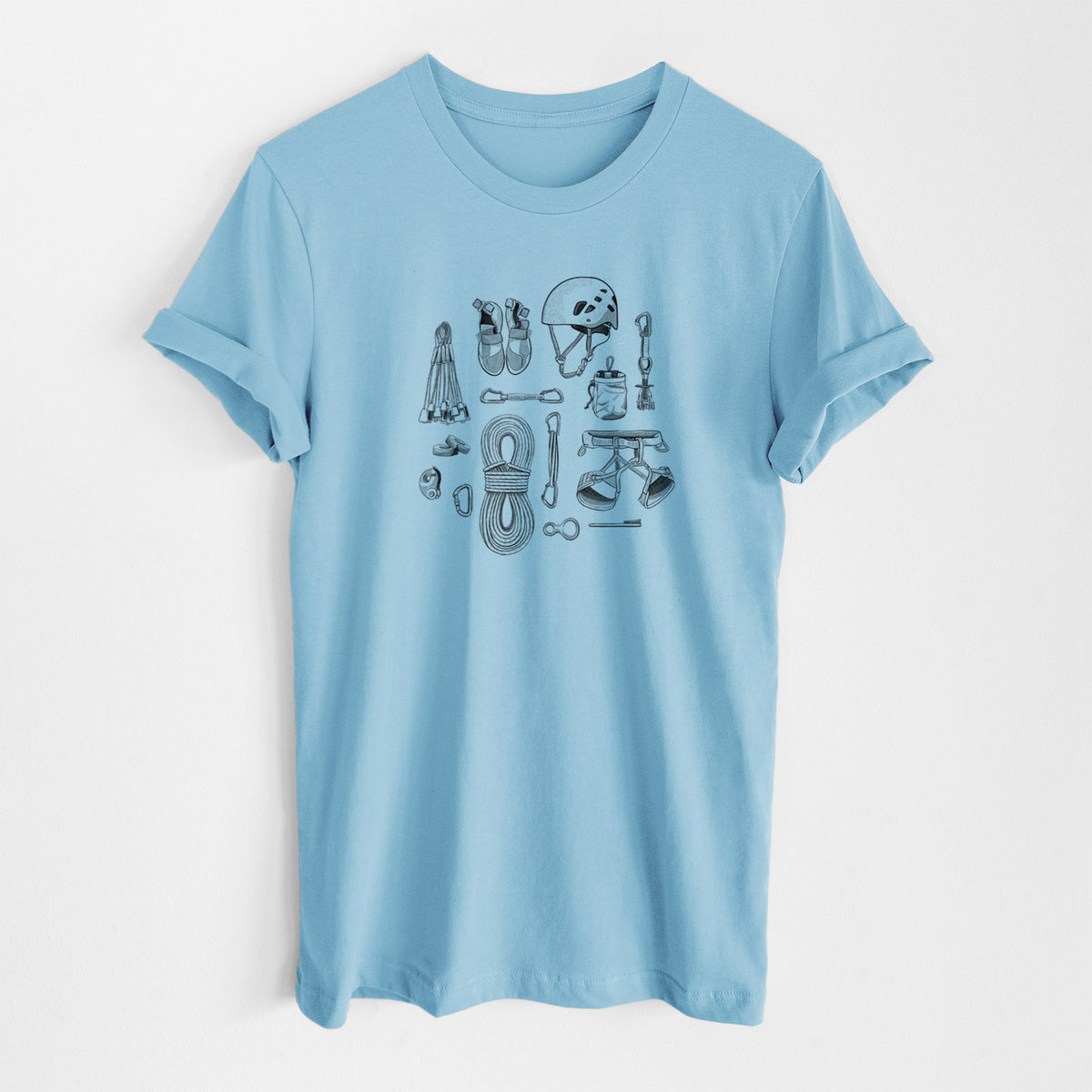 Ocean blue lightweight cotton t-shirt laid flat, printed with a black ink flat lay of rock climbing gear, including a helmet, shoes, rope, harness and carabiners.