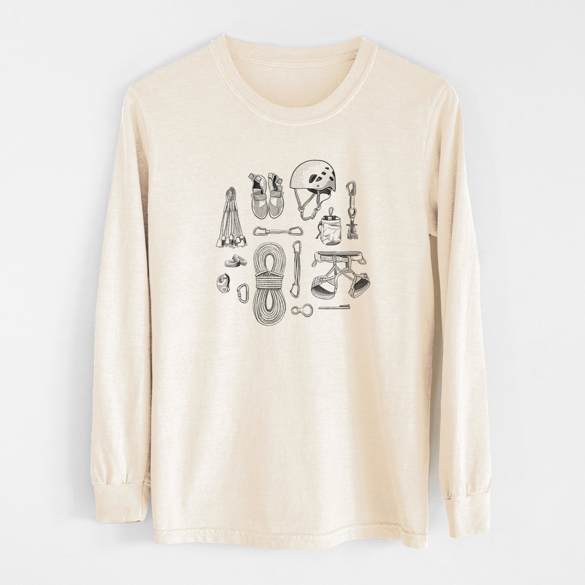 Ivory Comfort Colors long sleeve shirt laid flat, printed with a black ink flat lay of rock climbing gear, including a helmet, shoes, rope, harness and carabiners.