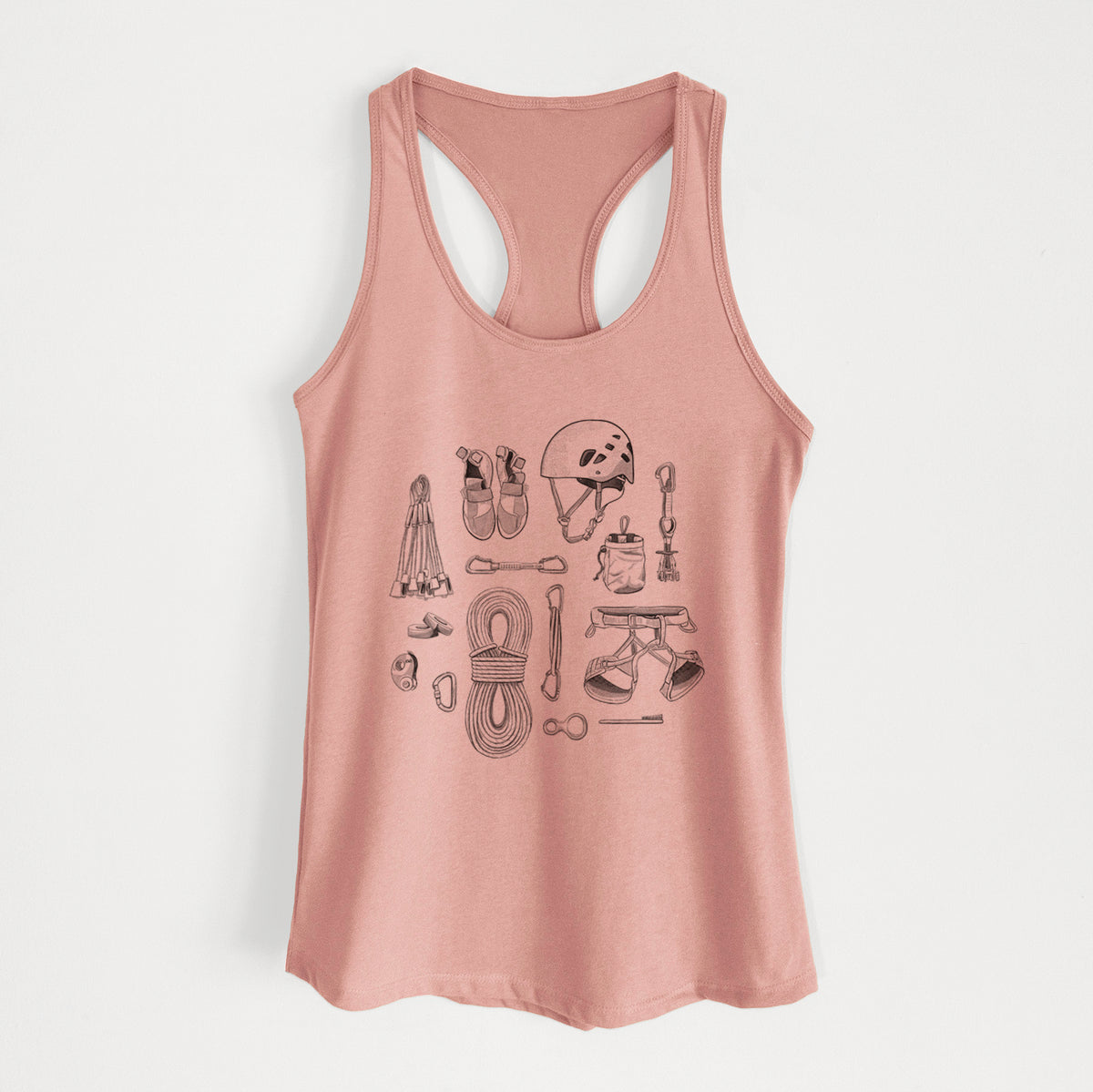 Desert pink women's racerback tank top laid flat, printed with a black ink flat lay of rock climbing gear, including a helmet, shoes, rope, harness and carabiners.