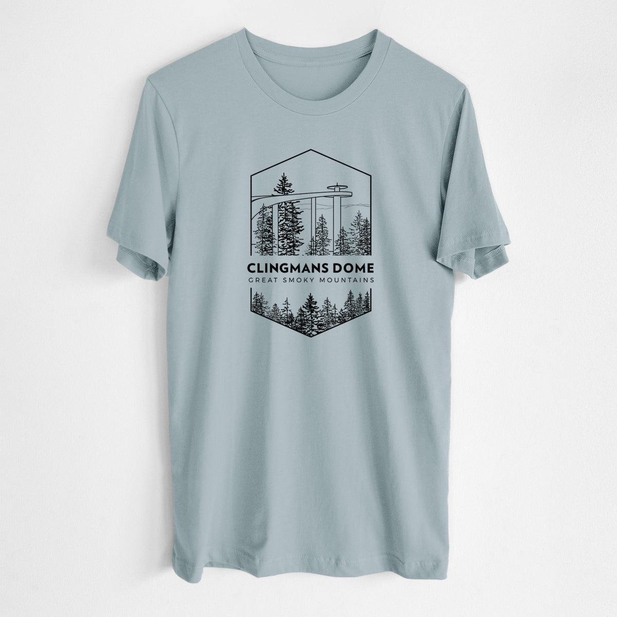 Vintage denim lightweight cotton t-shirt laid flat, printed with a black line art badge of the Clingmans Dome observation tower above a pine forest, with the words Clingmans Dome, Great Smoky Mountains.